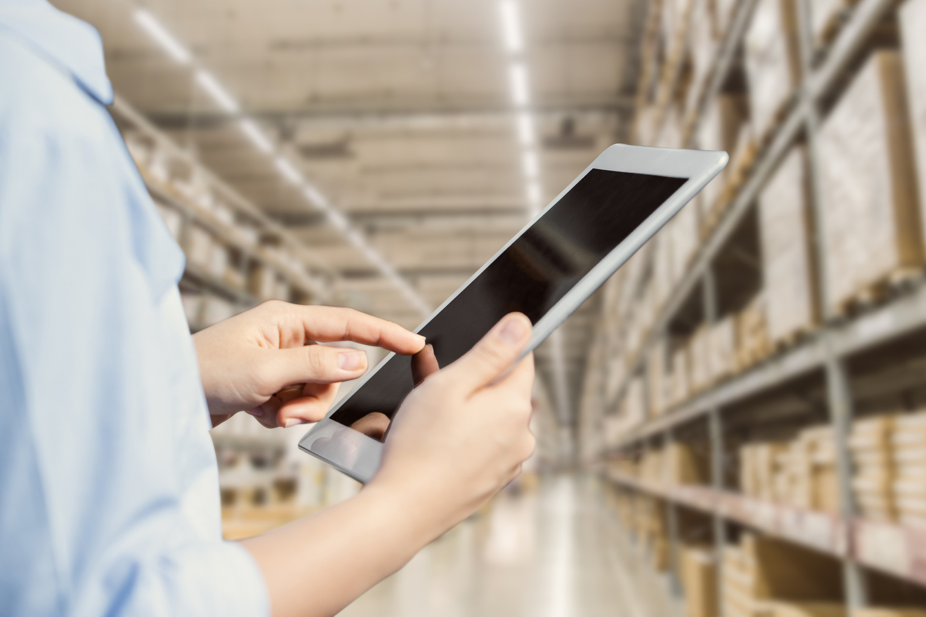 Staff Using Tablet with Smart Warehouse Tracking Inventory Management and Monitor Control Logistic System.
